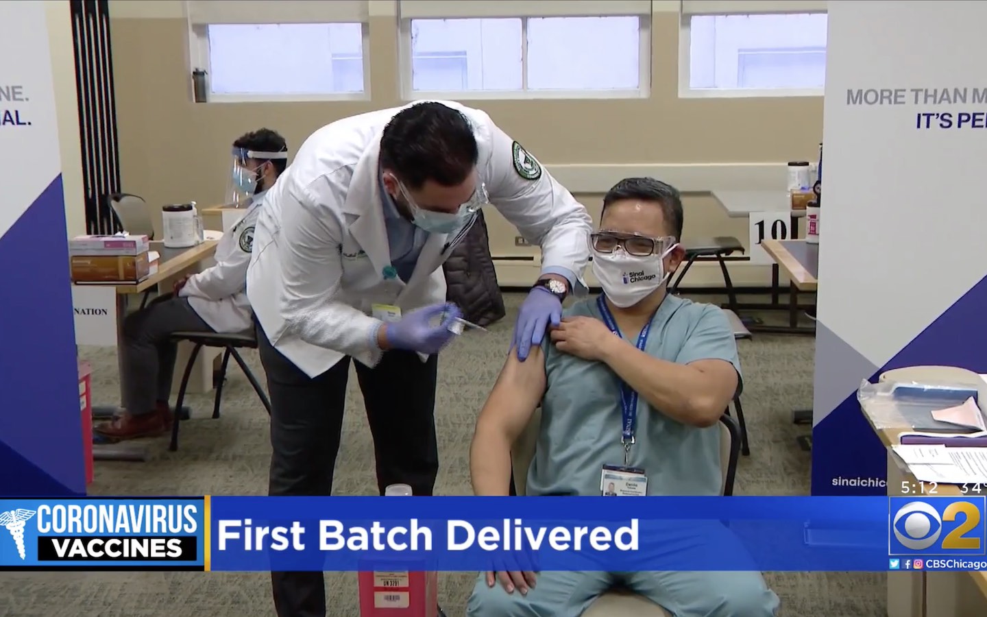 Pharmacy student Bellal Alzalam administers the COVID-19 vaccine on CBS-2.