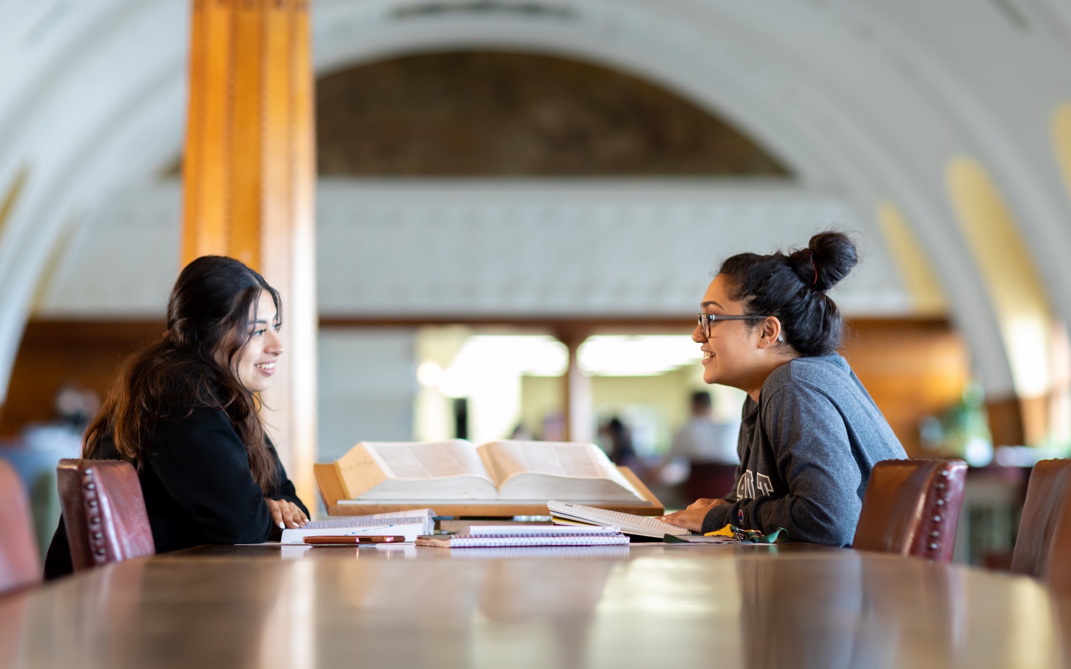 Two women students at a table in the Roosevelt library