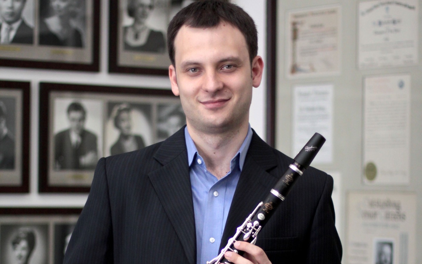 Roosevelt Chicago College of Performing Arts alum Sergey Gutorov, holding a clarinet