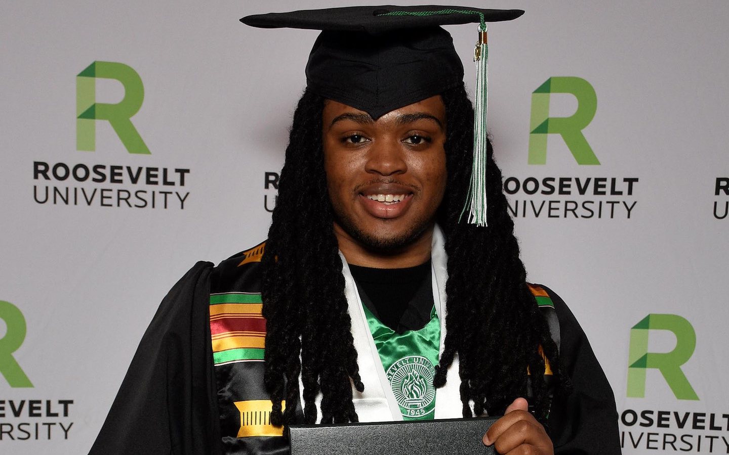 Roosevelt alum Cauve Vinson in his cap and gown