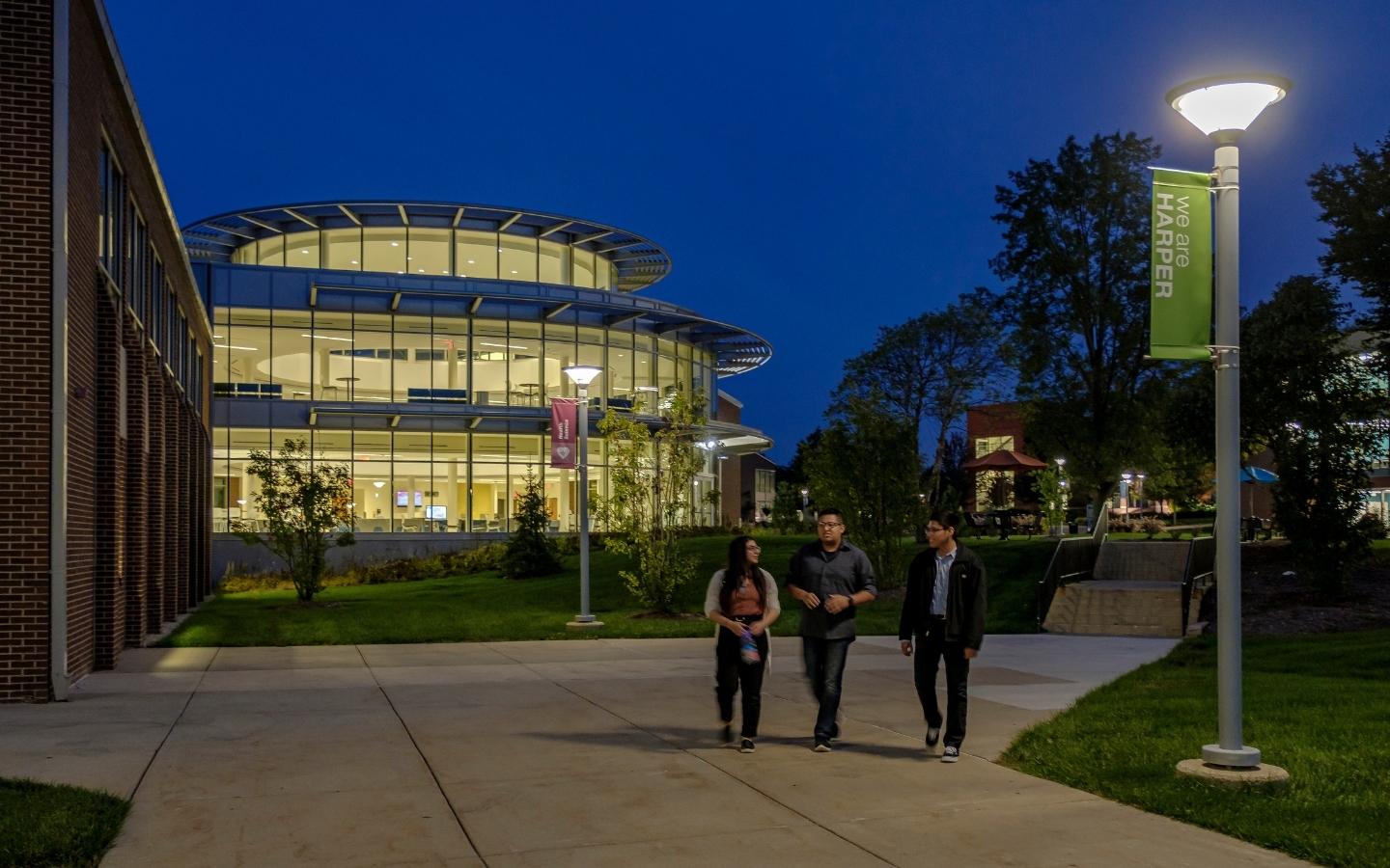 Students walking around Harper at night