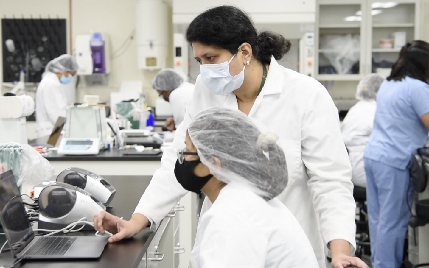 Pharmacy Faculty with student in compound lab