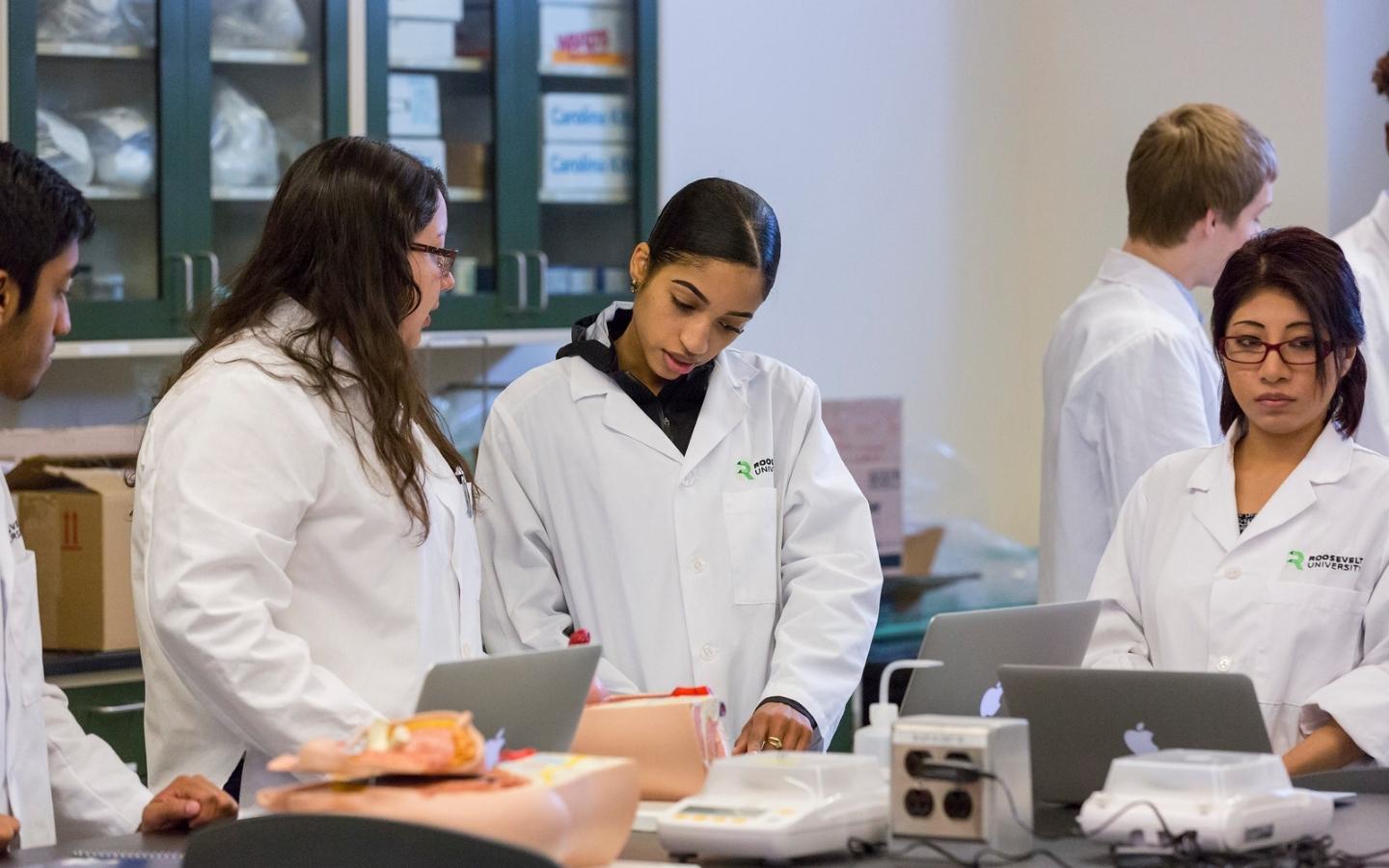 Pharmacy students working together in a lab