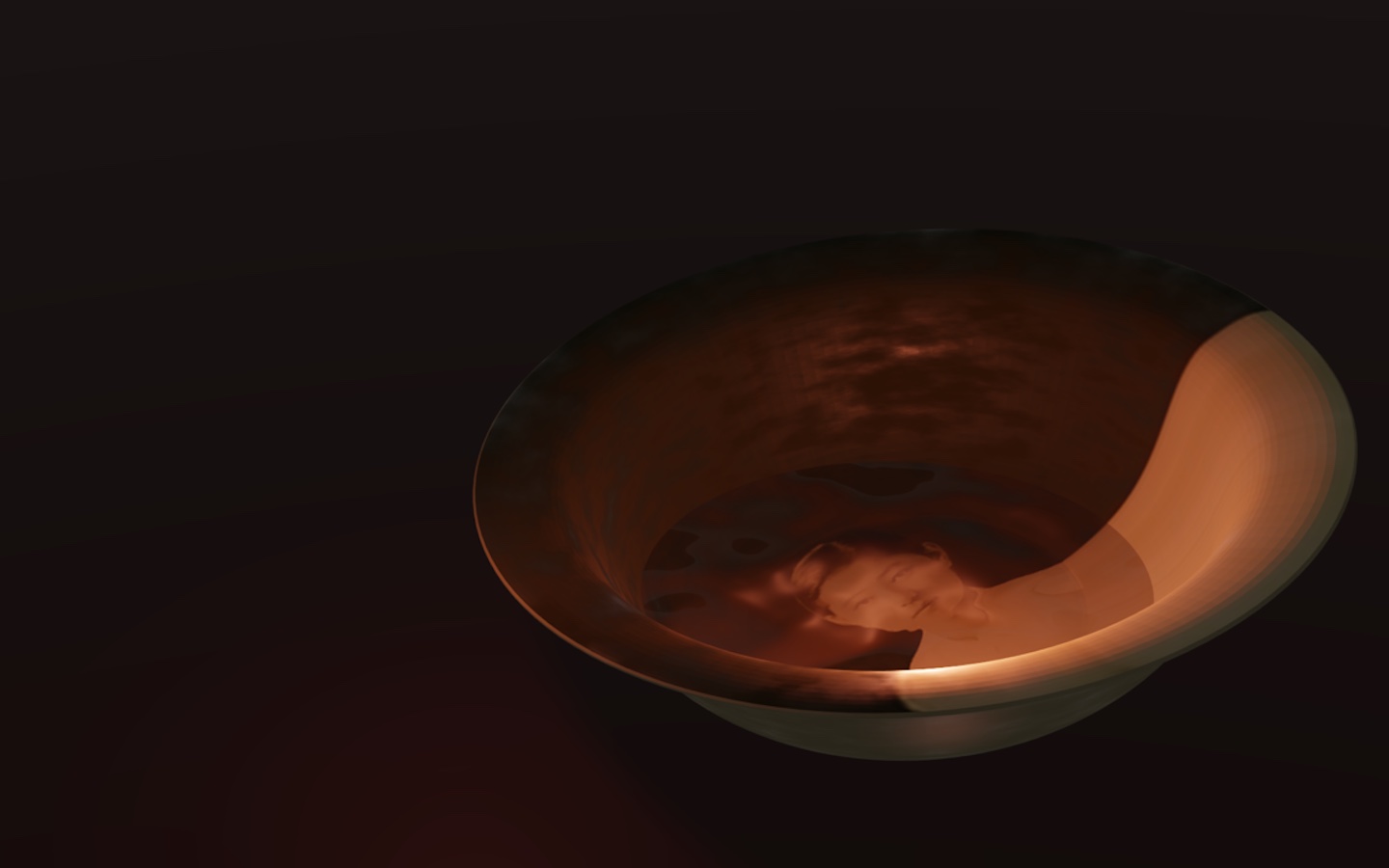 A woman's face reflected in a dark bowl