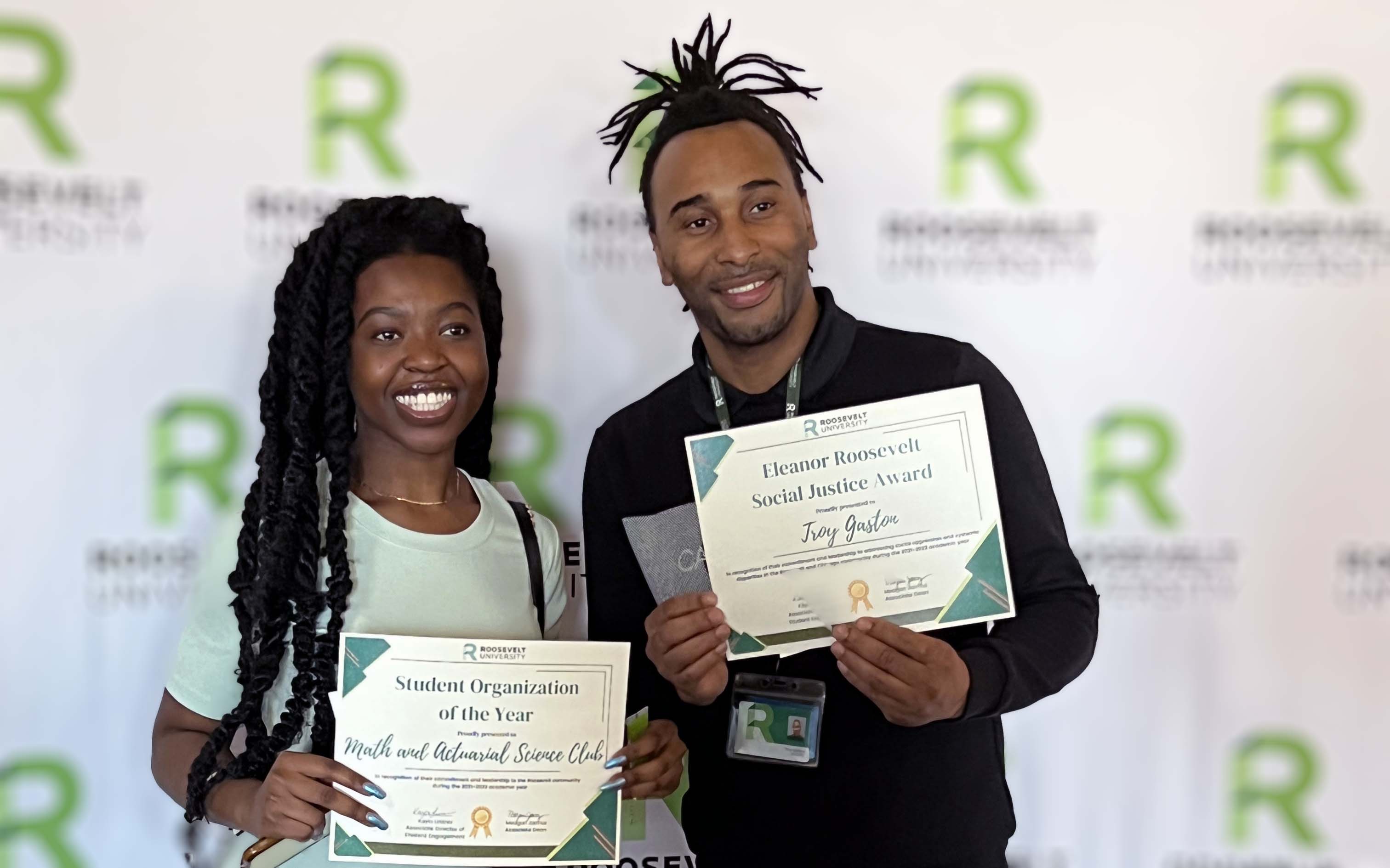 Troy Gaston (right) and a classmate at the Roosevelt University Student Leadership Awards ceremony