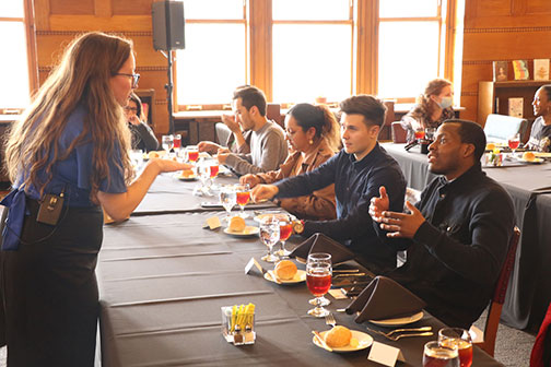 Students sitting at a table at a Career Services luncheon