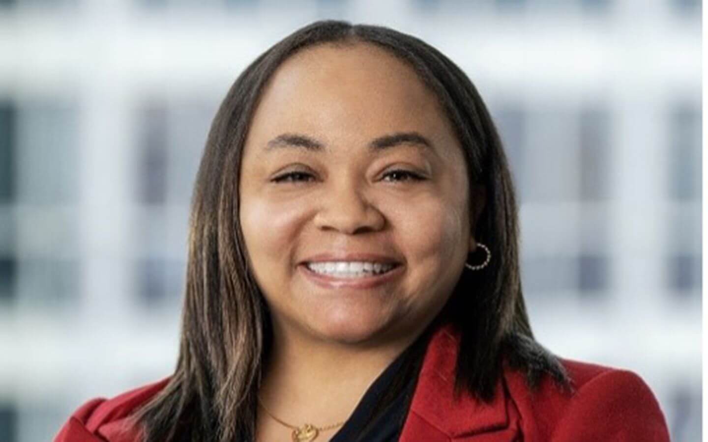 Brandy Norman smiling portrait, dressed professionally