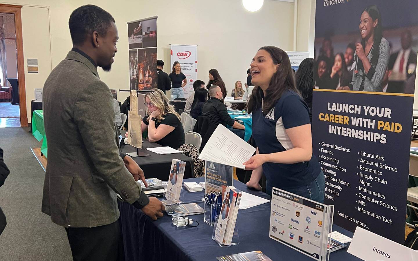 Student speaking with a company representative