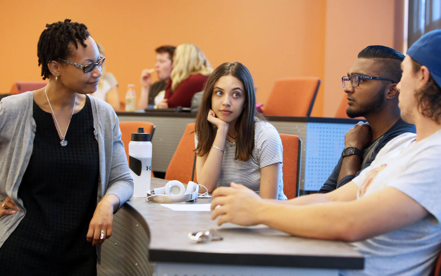 Students in class discussing - Academic and creative