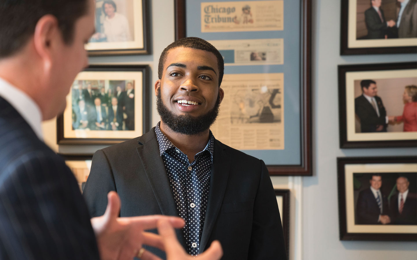 A student having a conversation with business faculty