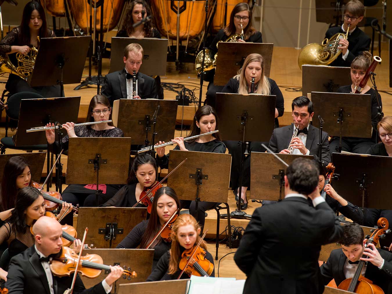 Roosevelt woodwind players in orchestra