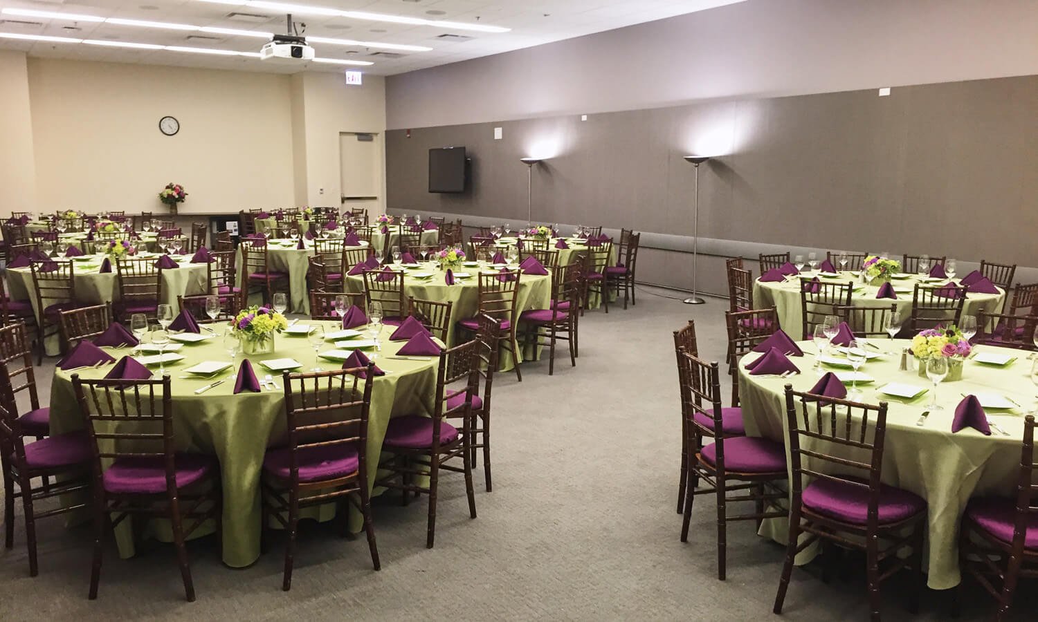 Large open space with elegant dining room seating for a reception 