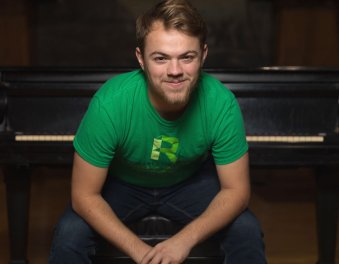 Student in green RU shirt