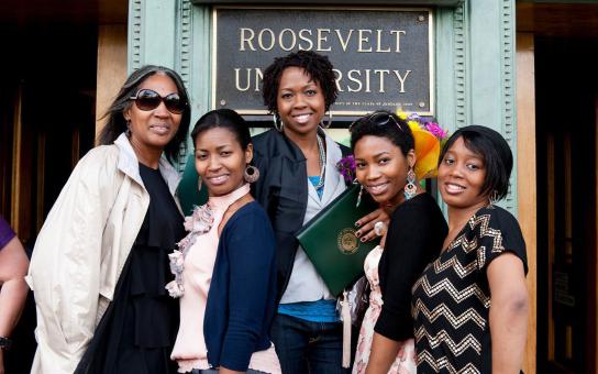 students in front of Roosevelt University sign