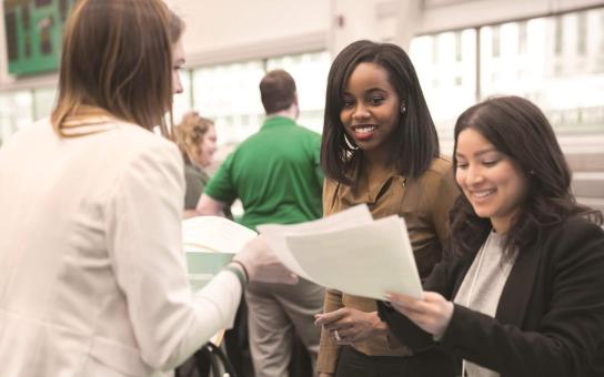 Female students visiting career fair