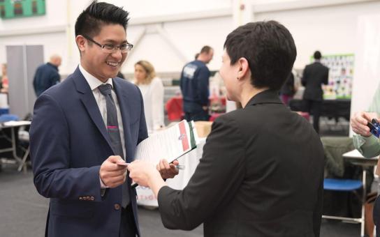 Student networking at career fair