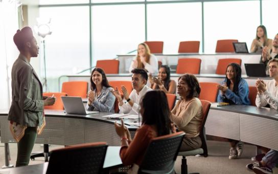 A group of diverse students engaging in a presentation