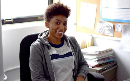 Female student smiles for a photo