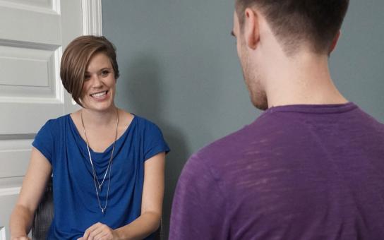 Two people having a face-to-face conversation