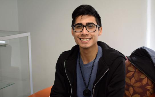 Student wearing glasses and smiling