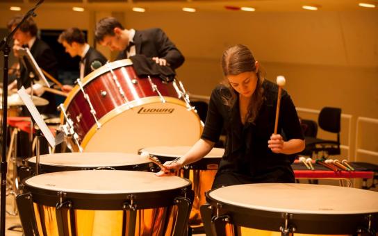 Percussionist playing on timpani