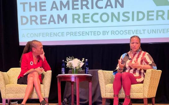 Moderator, Laura Washington, sitting in chair listening to Nikole Hannah-Jones also sitting on stage at the 2026 Roosevelt University American Dream Reconsidered Conference 