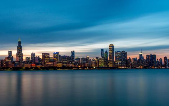 Cityscape from the lake at sunset