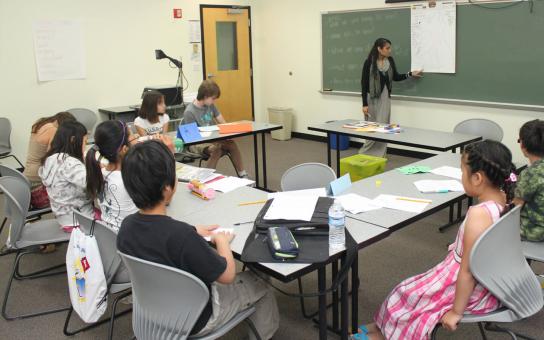 A College of Education student teaching children in a classroom