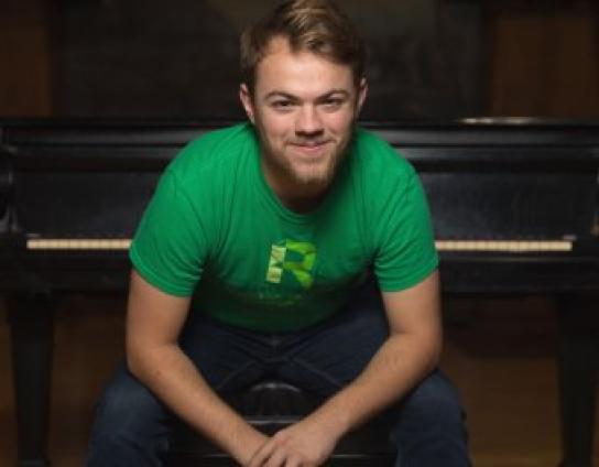 Student in green RU shirt